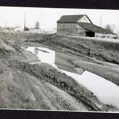 Photograph of Barn, House, and Water Hole, Date and Location unknown