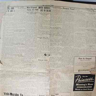 Page 1 newspaper, open, backside