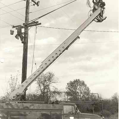 B. J. Rogers changing light bulb.