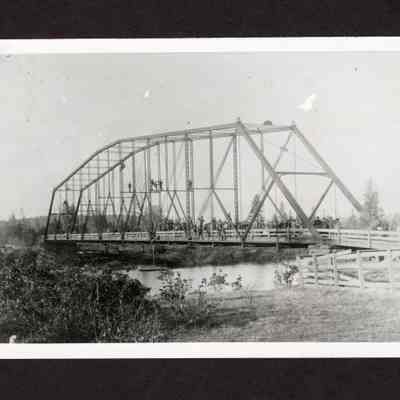 Photograph of Group of People on Bridge Over River, Undated