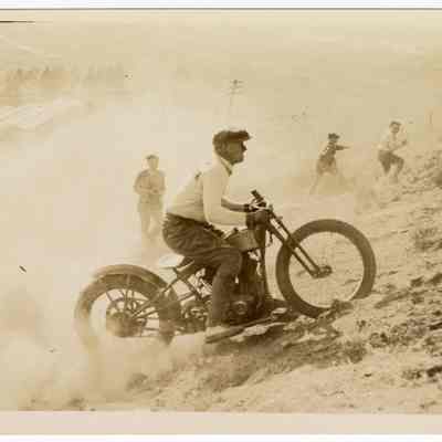 Photograph of Bill Davis on a motorcycle hill climb, circa 1930
