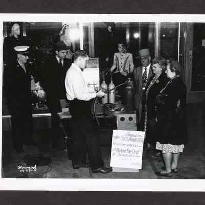 Photograph, People at the Springfield Volunteer Fire Departments respirator demonstration, storefront and date unknown.