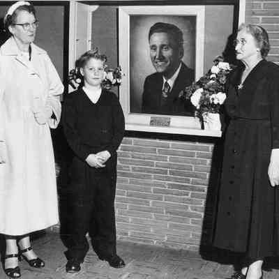 Photograph of portrait of Lawrence Moffitt on wall at Moffitt School, Springfield, Oregon, date unknown.