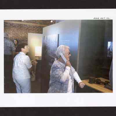 Photograph of people at Springfield Museum's "Working in the Woods" Exhibit, Springfield, Oregon, 2000