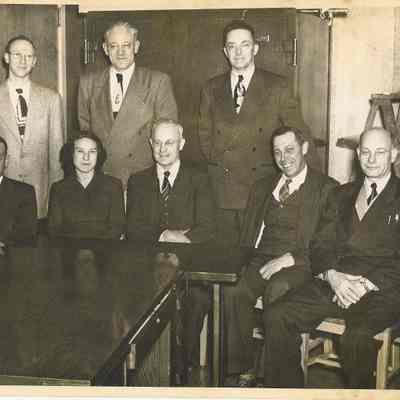 Photograph of eight unidentified officals at Springfield Union High School, Springfield, Oregon, unknown date