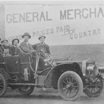 Photograph of men in an automobile, date unknown