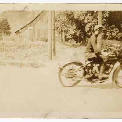 Photograph of Bill Davis riding his motorcycle, circa 1930