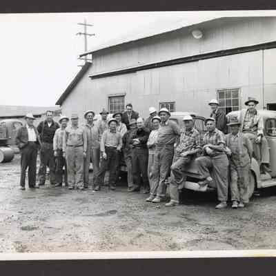Photograph of 20 Workers standing outside of Booth-Kelly Lumber Mill, Springfield, Oregon, undated