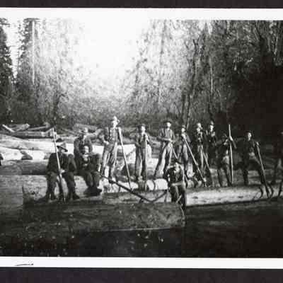 Photograph of a thirteen men logging crew on a log pond, Mohawk River, circa 1900-1901