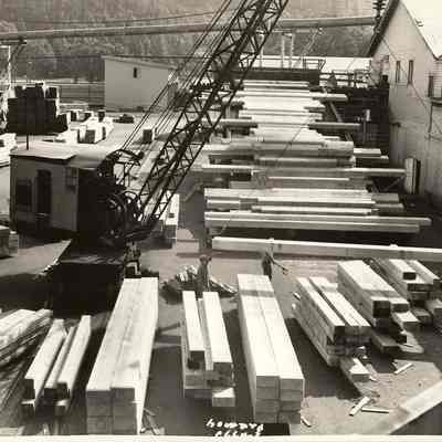 Photograph of Men Sorting Lumber at Lumber Yard, Undated