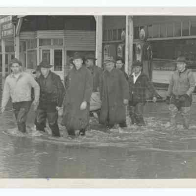 Photograph of people wading through high water in Springfield, 1943