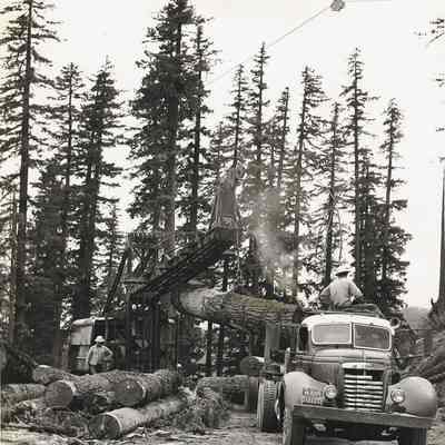 Logging Truck Being Loaded, circa 1962-63