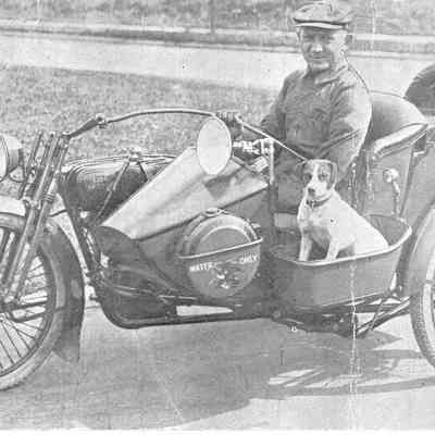 Photograph in newspaper of legless, one-armed man on a Harley-Davidson Motorcycle, 1918