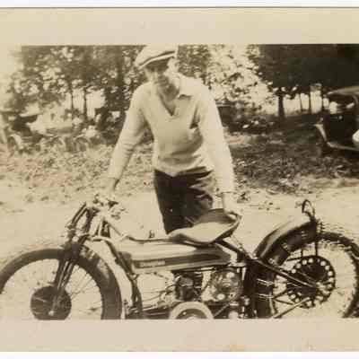 Photograph of an unknown man and a Douglas motorcycle, circa 1920