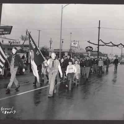 Photograph of Boy Scouts carrying the colors in Christmas Parade. Date unknown.