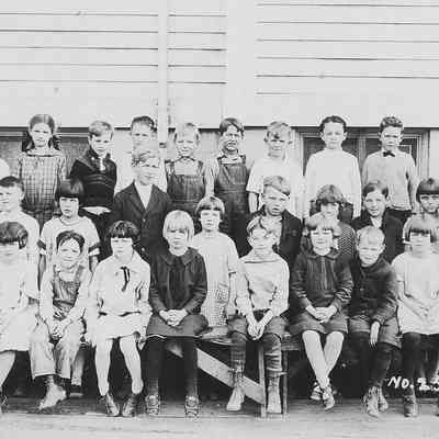 Photograph of class picture with teacher Mrs. Crystal Male, Springfield, Oregon, date unknown.