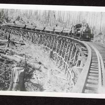 Photograph of Booth-Kelly Co 3 Spot Locomotive hauling logs across trestle above Wendling, Oregon, circa 1914