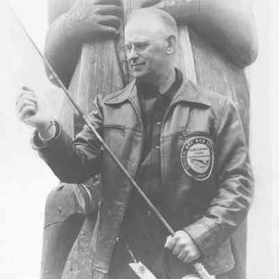 Photograph of former police chief Harry Howard with fishing pole, circa 1939