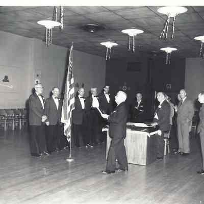 Photograph of B.J. Rogers and a group of men, Unknown date and location