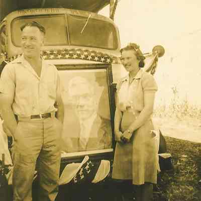 Photograph of two people in front of Booth-Kelly lumber truck, Springfield, Oregon, 1941