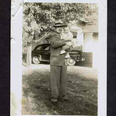 Photograph of a man and his grandson, undated