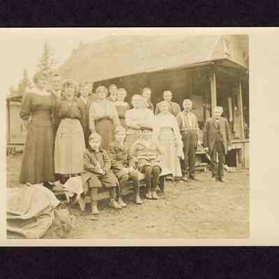 Photograph on postcard of a family photo of 17 unknown people