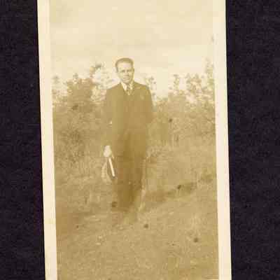 Photograph of unknown man standing outside
