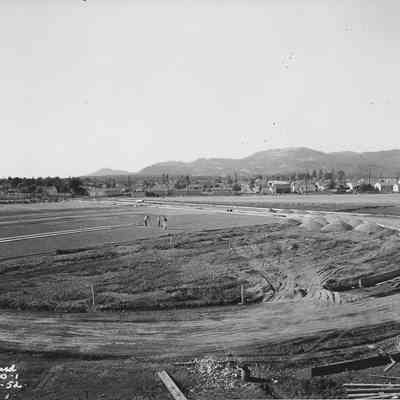 Photograph of surveying site of Silke Field track, Springfield, Oregon, 1952