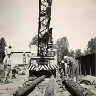 Photograph of workers on Willamette bridge, 1957.