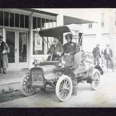 Photograph of a couple in old Cadillac