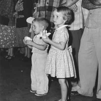 Photograph of two children eating sandwiches at Shoppers Paradise event, Springfield, Oregon, 1957