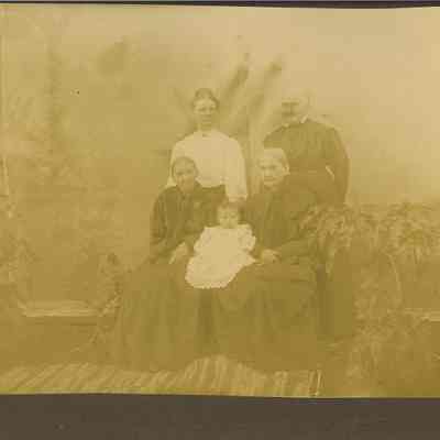Photograph of a portrait of four women & baby; c. 1890-1910