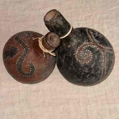 Pair of decorative gourds, tied together at the neck