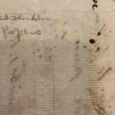 Close up of back of item with writing in pencil