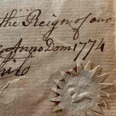 Close up photo of seal bottom right of page.