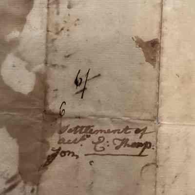 Close-up of writing on back and pencil marks