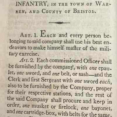 By-Laws: The book is titled "BY-LAWS FOR THE WELL ORDERING AND DISCIPLINING OF THE WARREN LIGHT INFANTRY, IN THE TOWN OF WARREN, AND COUNTY OF BRISTOL." The visible text on the page outlines various articles regarding the obligations and requirements of individuals in the Warren Light Infantry, including details about meetings, uniforms, and assemblage.
