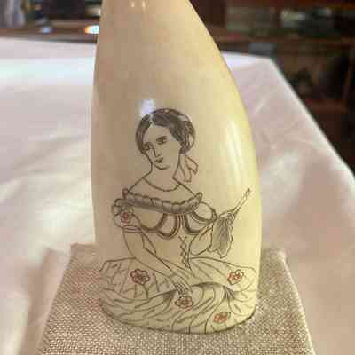 Scrimshaw: Woman Holding Leaf