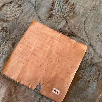Back of cloth with sewn note