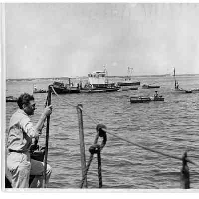 Blount Seafood man overlooking fishing boats 25x20 black and white glossy