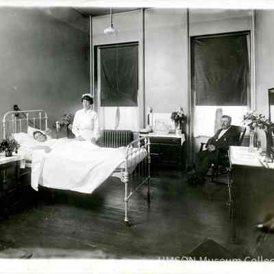 Nellie E. Dix, DIN 1916 attending to a private patient, University Hospital, Maryland, 1920