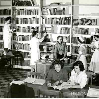 Nursing students in library