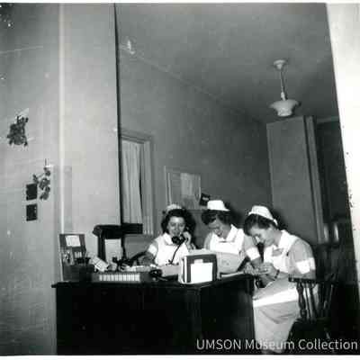 Three Student Nurses at a Desk, University Hospital