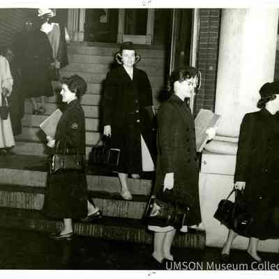 Student nurses leaving outpatient clinic for public health rounds