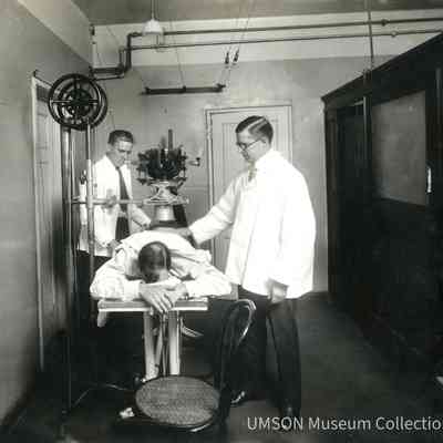 Dr. Comas and Dr. Watson with a Patient, University Hospital, Maryland, X-Ray Department, 1920