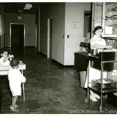 Student nurse sorting medications on pediatric ward, University Hospital