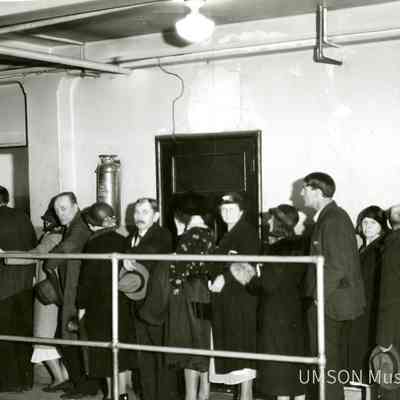 White patients standing in line, basement of University Hospital, Lombard and Green Streets, 1934
