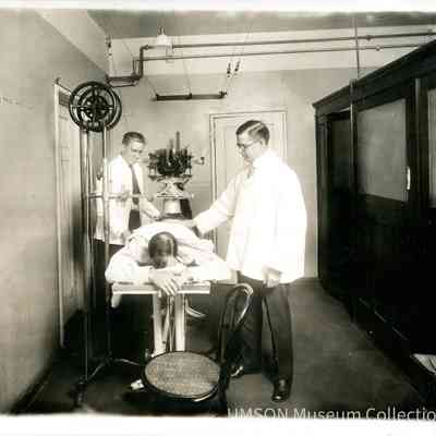 Dr. Comas and Dr. Watson with a Patient, University Hospital, Maryland, X-Ray Department, 1920
