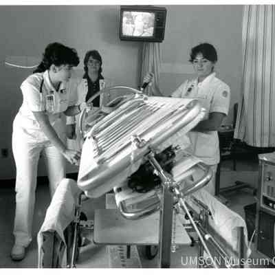 Nursing students turning a patient in a Stryker frame while a supervisor watches, University of Maryland Medical Center