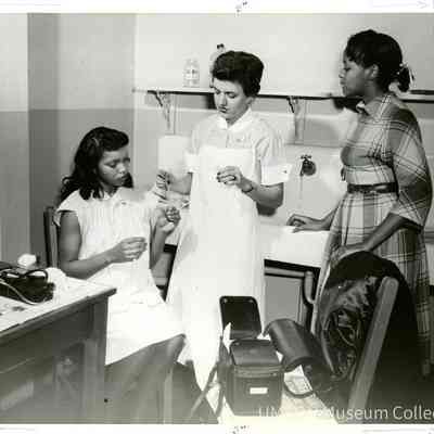 Nursing student on public health home visit with patient